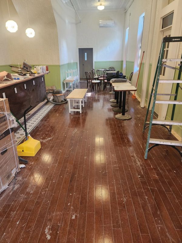 Before sanding hardwood flooring in a small restaurant in Ridgewood, Brooklyn.