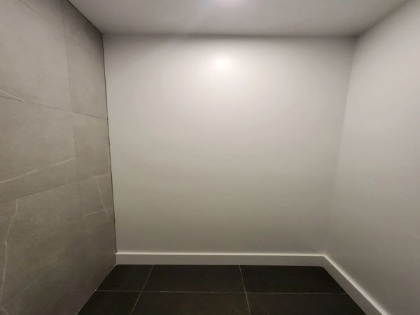 A first look at a half bathroom in Jersey City, NJ. We added a shower stall w/ glass doors.
