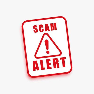 Red and white sign warning of a scam alert.