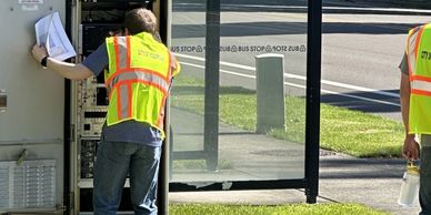Image of person inside traffic signal cabinet