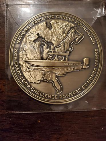 Commemorative medal for National Pediatric Cancer Foundation event.