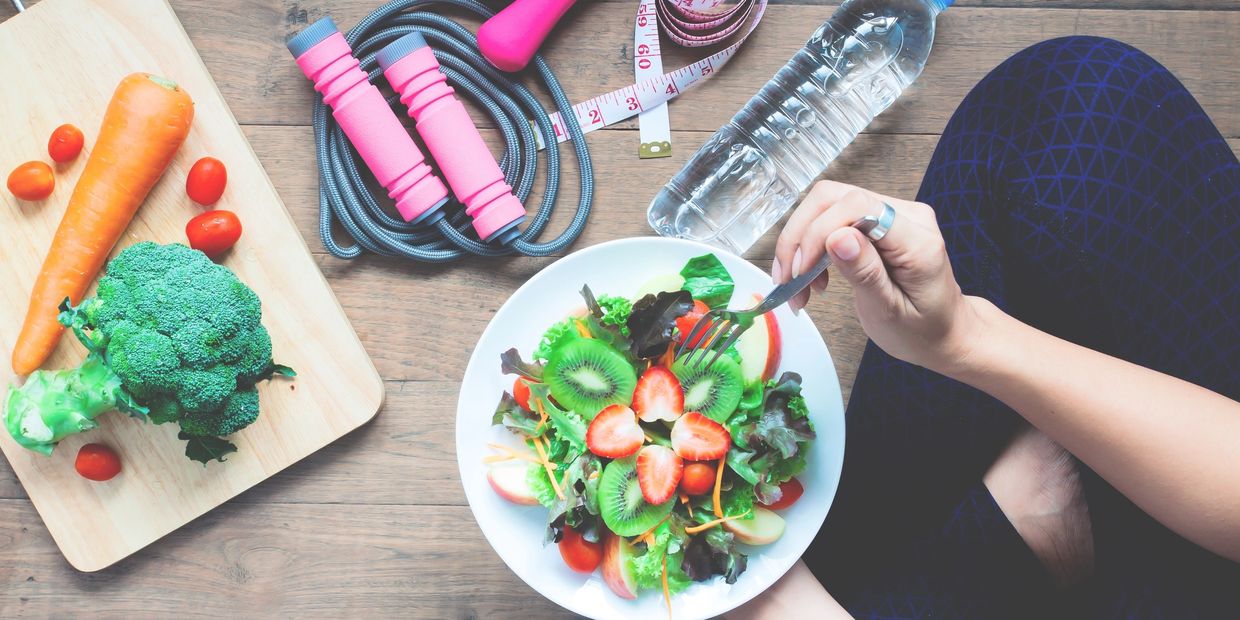 Yoga female cooking homemade salad, Healthy food