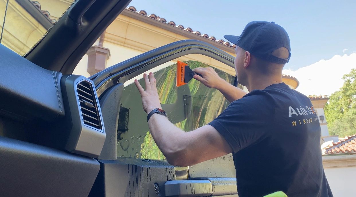 Mobile window tint film installation on truck passenger door
