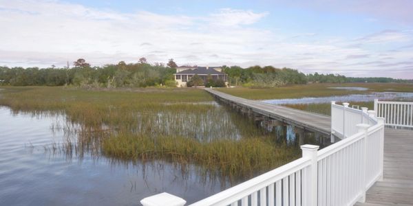 Dock house deck with marsh walkover