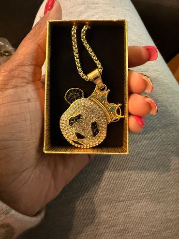Gold panda pendant necklace with crown.