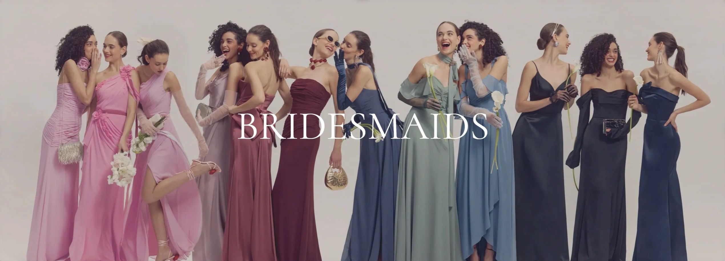 Group of bridesmaids in elegant dresses.