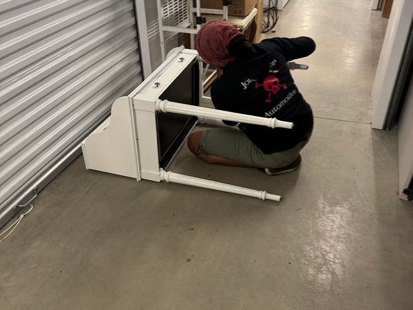Volunteer building a desk.