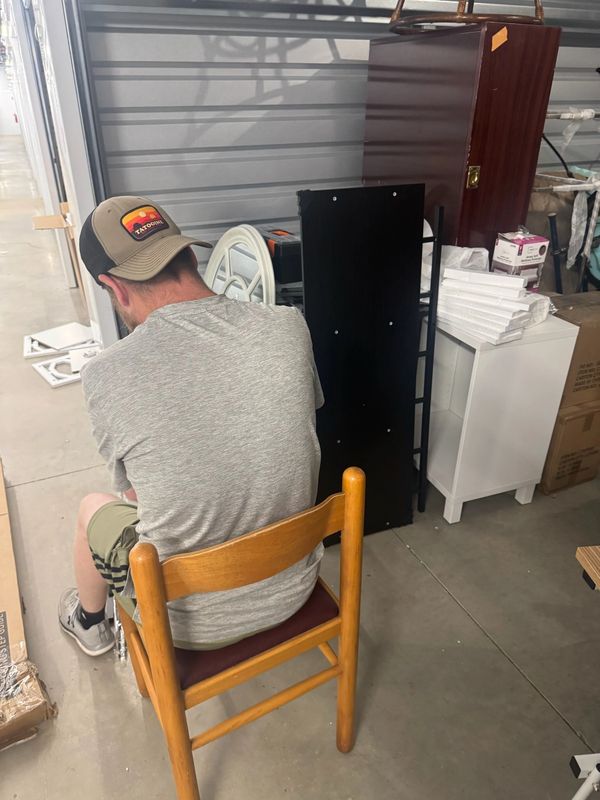 Volunteer working while seated in a chair.