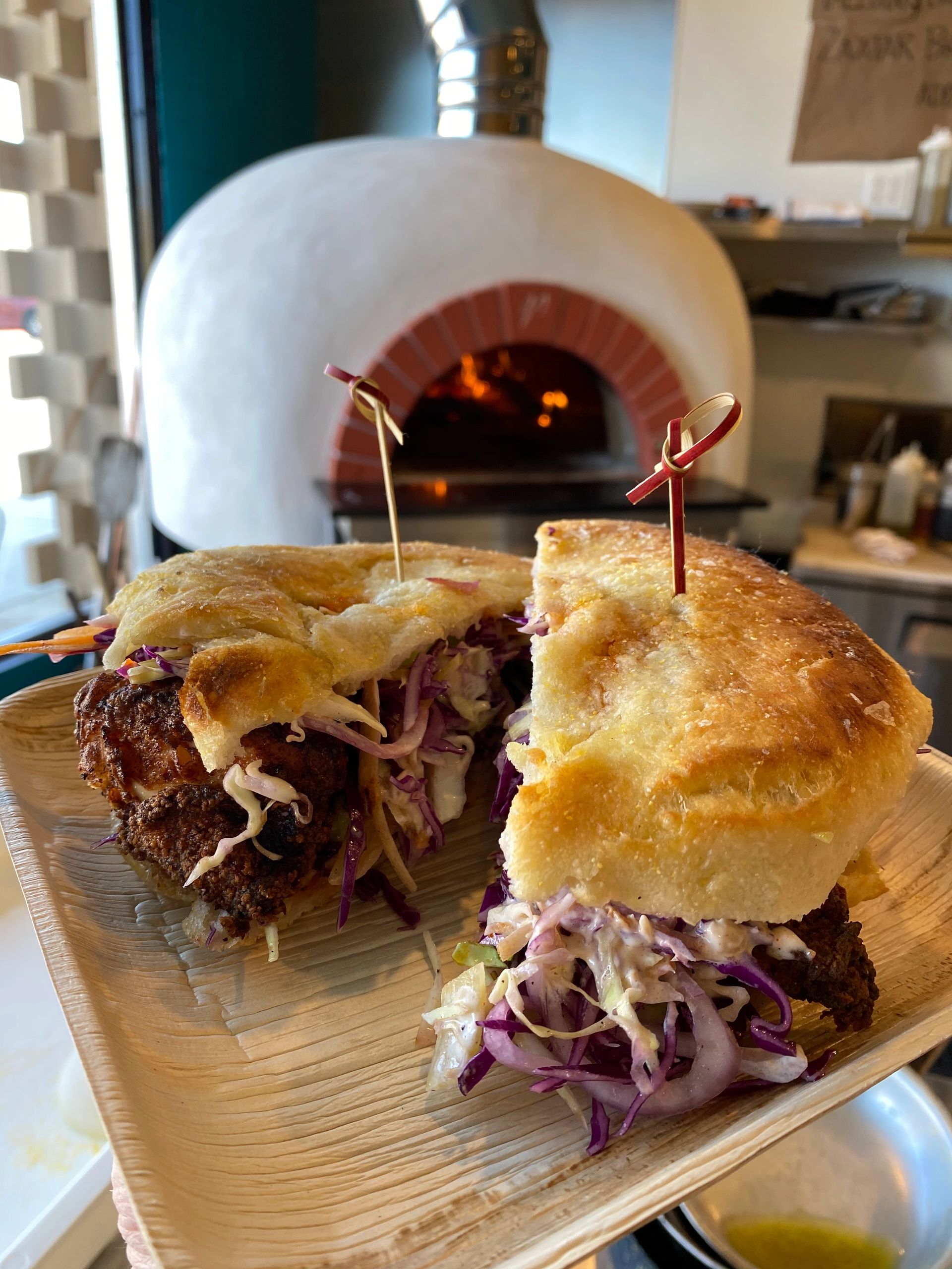 Koji fried chicken sandwich on puccia bread baked in the pizza oven at Eye on I in Lompoc. 
