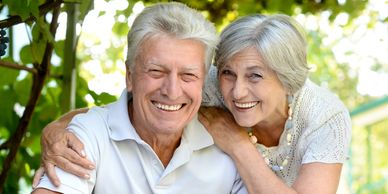 smiling elderly couple