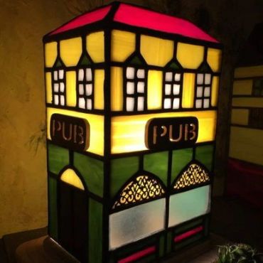 Lit stained glass pub lamp.
