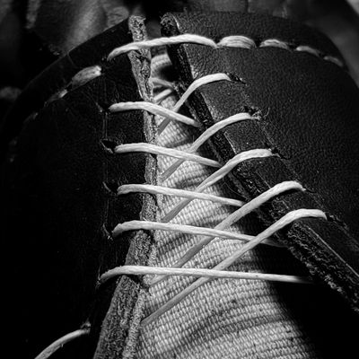 Hand-stitching, leather, repair, thread, sewing, patching.