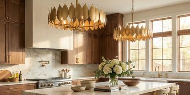 Elegant kitchen with wooden cabinets and gold leaf chandeliers.