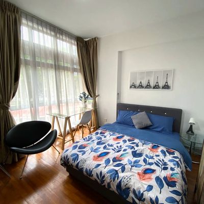 Ensuite room that is furnished with a queen bed, beddings, study desk and chairs 