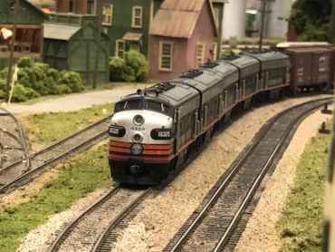 Model train on a miniature railway layout.