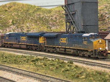 Model CSX trains on a miniature railway.