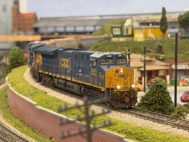 Model train on a miniature railway layout.