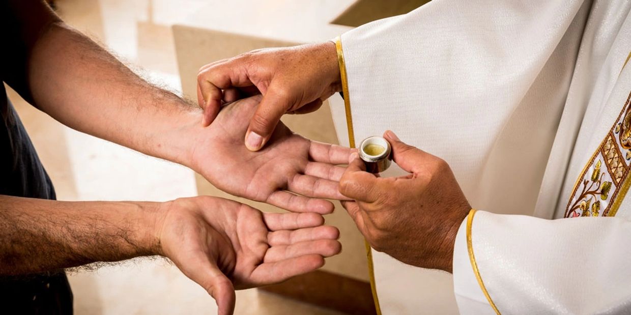 Image of a Priest administering Anointing of the Sick. 