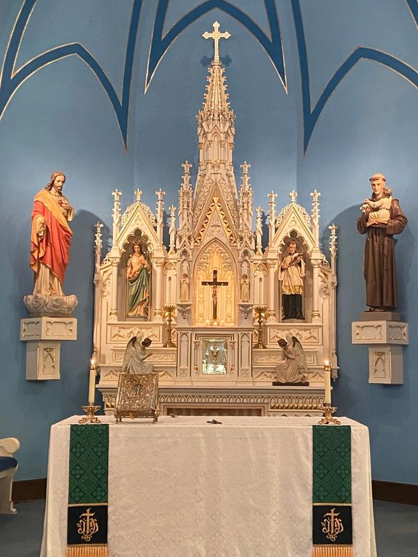 Image of the inside of St. Mary's Catholic Church looking at the Altar and Tabernacle. 