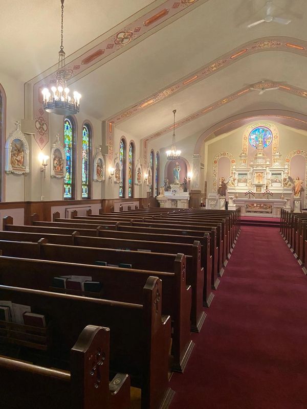 Image of the inside of St. Patrick's Catholic Church looking at the altar. 