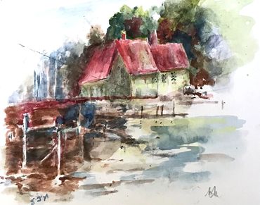 Watercolor painting of houses by the water.