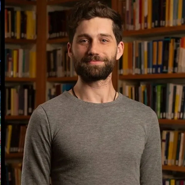 Artist Michael Garfield with his colorful, surreal oil and acrylic paintings of fantastical creatures.