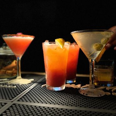 Colorful cocktails and Martini's set with black background.