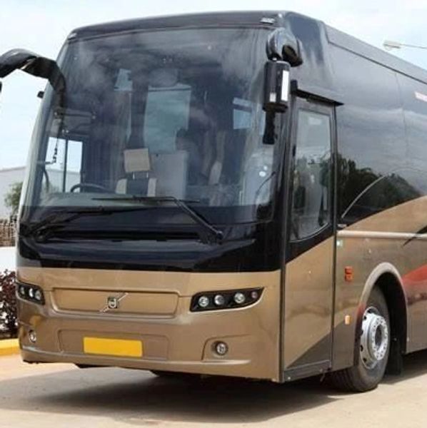 A sleek, modern Volvo coach bus parked on a clean street.