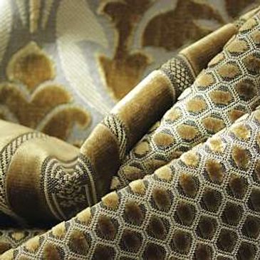 Close-up of a textured pipe and patterned fabric.