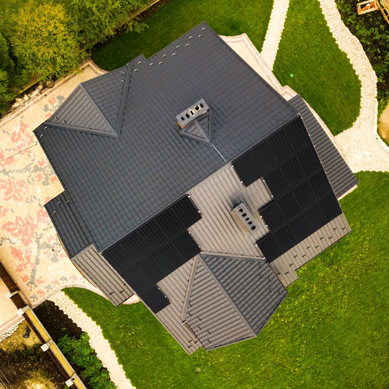 Photo of a solar PV recent installation maximising as many panels on the available roof space.