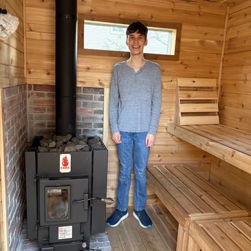 Ethan in the traditional Finnish wood-fired sauna that helped build in his family's backyard.