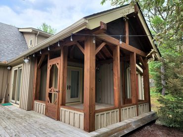 Restored Muskoka porch with professional wood restoration, media blasting, and premium stain finish.