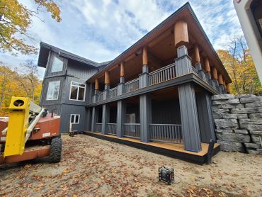 Restored Muskoka log home with professional media blasting and premium stain finish.