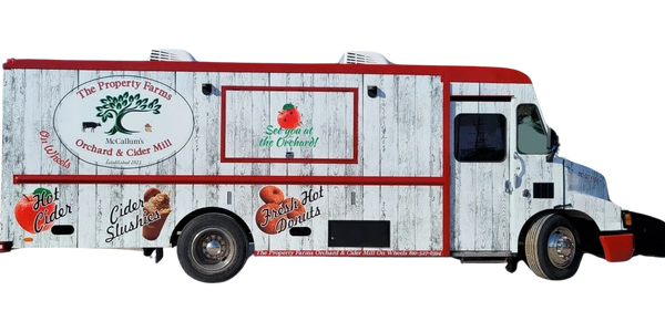 Food truck selling fresh made donuts and cider.