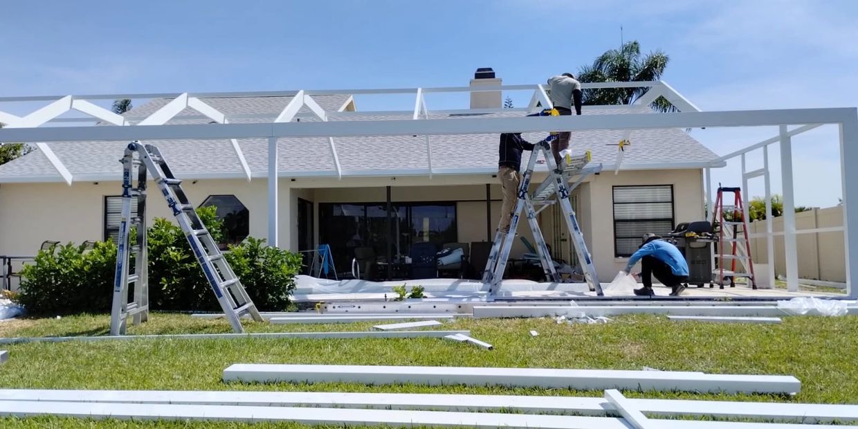 Supporting a pool cage while installing new drip edge. Custom pool enclosures Sarasota.

