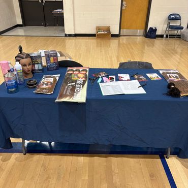 Table displaying hair care and styling products and tools.