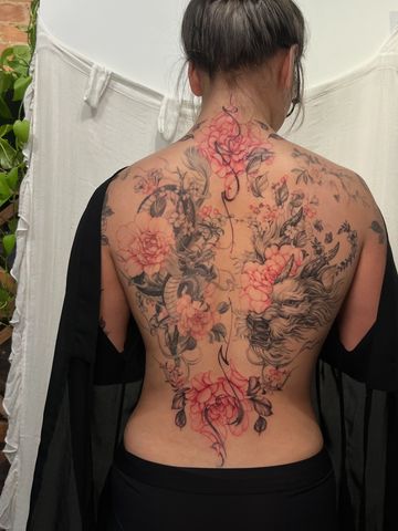 Fu Dog tattoo on back with peonies fine line style tattoo Asian black and red ink tattooed girl 