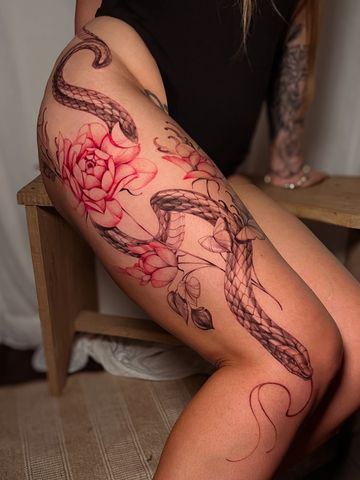 Snake beautiful floral tattoo femme energy red bright color details graphic fine line artistic visio