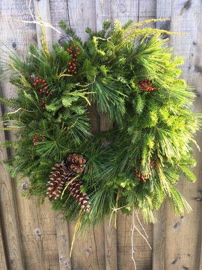 Self-made Christmas Wreath on River Ridge Lodge barn.