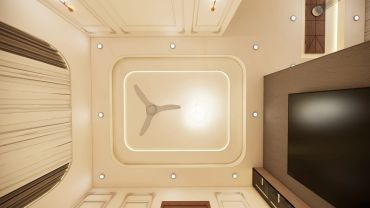 Ceiling fan and TV in a modern room.