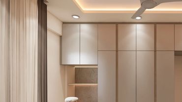Modern room with built-in storage and desk.