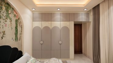 Modern bedroom with built-in wardrobe and soft lighting.