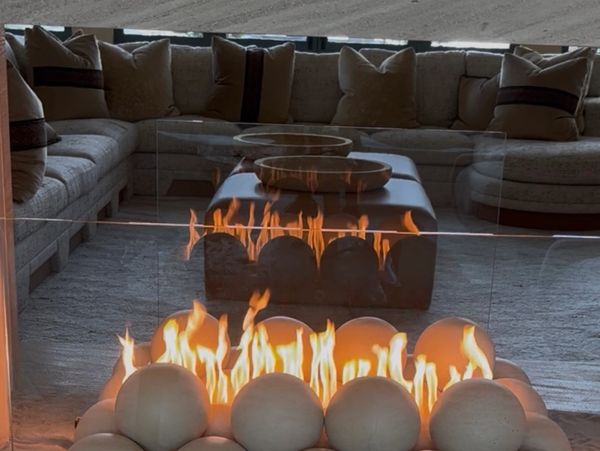 Modern fireplace in a cozy living room setting.