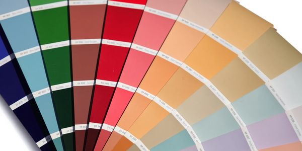 A fan of color swatches displaying a wide range of hues.