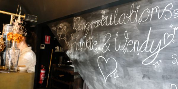 Chalkboard with congratulatory message to Frankie and Wendy.