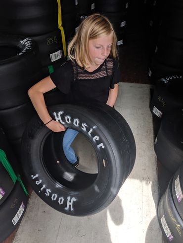 NASCAR pit crew selecting tires for super late model race car at Evergreen Speedway in Washington 