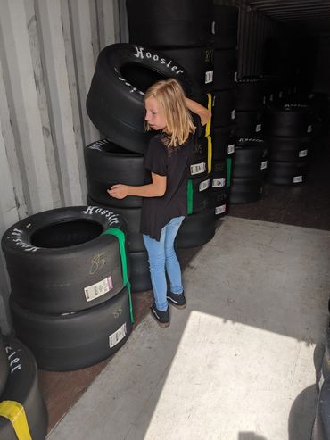 NASCAR pit crew selecting tires for super late model race car at Evergreen Speedway in Washington 