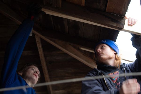 Garage Door Technicians Adding Support, Carefully Planning Garage Door Installation and Service Plan