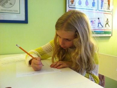 A student ponders wha to write next.