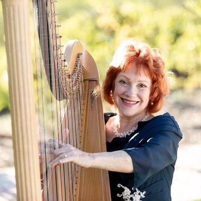 Naomi Alter San Diego Harpist playing harp at a wedding!